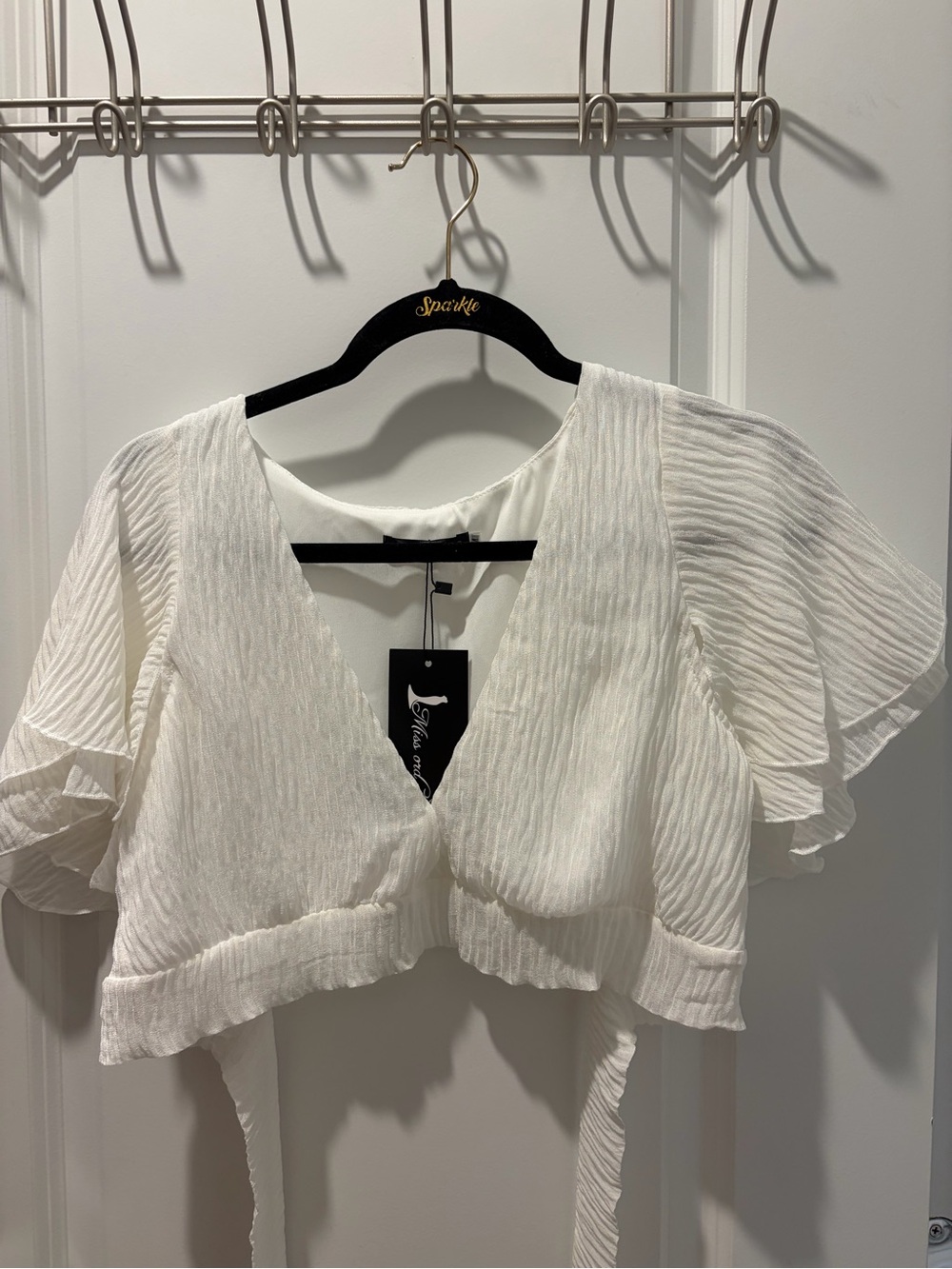 White Women's V-Neck Ruffle Tie-Front Top with Tiered Ruffles Skirt.
